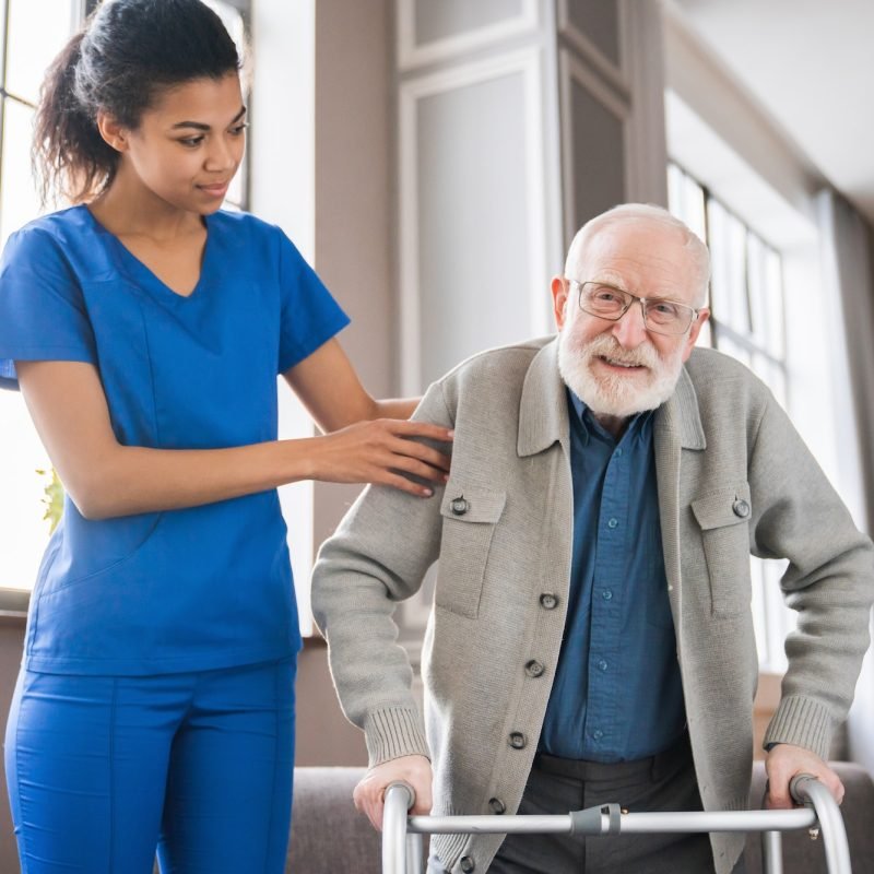 handicapped-man-using-walker-rehabilitation-at-home-nurse-helping-disabled-man-using-walker.jpg handicapped-man-using-walker-rehabilitation-at-home-nurse-helping-disabled-man-using-walker.jpg